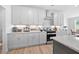 Modern kitchen with white cabinets, stainless steel appliances, and stylish decor at 302 Bunker Hill Ct, Acworth, GA 30102