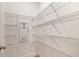 Spacious walk-in closet with wire shelving and ample storage, ideal for organization at 302 Bunker Hill Ct, Acworth, GA 30102