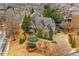 An aerial view highlights this brick home's mature landscaping, quiet street, and well-kept surroundings at 2310 Gracehaven Way, Lawrenceville, GA 30043