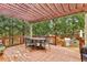 Spacious back deck offers ample seating and a stone outdoor kitchen overlooking a private backyard at 2310 Gracehaven Way, Lawrenceville, GA 30043