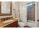 Bathroom with granite counters, tile shower and floors at 2310 Gracehaven Way, Lawrenceville, GA 30043