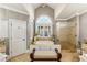 Bright and spacious bathroom features a soaking tub and glass-enclosed shower at 2310 Gracehaven Way, Lawrenceville, GA 30043