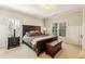 Bedroom features a large bed, two windows providing lots of light, and paneled walls at 2310 Gracehaven Way, Lawrenceville, GA 30043