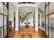 Grand foyer with soaring ceilings, hardwood floors, curved staircase, and elegant decor setting a luxurious tone at 2310 Gracehaven Way, Lawrenceville, GA 30043