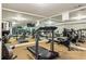 Mirrored home gym featuring cardio equipment, free weights, and mounted TV at 2310 Gracehaven Way, Lawrenceville, GA 30043