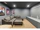 Basement home theater boasts comfortable seating, a neutral color scheme, and recessed lighting at 2310 Gracehaven Way, Lawrenceville, GA 30043