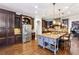 Gourmet kitchen featuring stainless steel appliances, a large island, and custom cabinets at 2310 Gracehaven Way, Lawrenceville, GA 30043