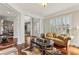 Elegant living room with hardwood floors, decorative columns, and abundant natural light at 2310 Gracehaven Way, Lawrenceville, GA 30043