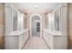Luxurious bathroom featuring dual vanities and tile flooring at 1790 Mountain Farm Rd, Woodstock, GA 30188
