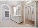 Bathroom featuring dual vanities with direct closet access at 1790 Mountain Farm Rd, Woodstock, GA 30188