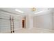 A spacious bedroom with custom built-in bookshelves and a charming rolling ladder at 1790 Mountain Farm Rd, Woodstock, GA 30188