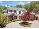 Beautiful home exterior with a circular driveway and mature landscaping at 1790 Mountain Farm Rd, Woodstock, GA 30188