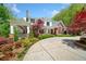 Charming two-story home with a covered porch and beautifully landscaped front yard at 1790 Mountain Farm Rd, Woodstock, GA 30188