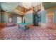 Large game room featuring a pool table, spiral staircase, and custom woodwork, creating an inviting entertainment space at 1790 Mountain Farm Rd, Woodstock, GA 30188