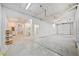 Spacious garage area with concrete flooring and bright lighting at 1790 Mountain Farm Rd, Woodstock, GA 30188
