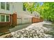 Spacious three-car garage with ample parking space and a brick exterior at 1790 Mountain Farm Rd, Woodstock, GA 30188