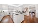 Open kitchen with stainless appliances, custom cabinetry, and large island with seating at 1790 Mountain Farm Rd, Woodstock, GA 30188