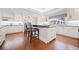 Gourmet kitchen boasts large island with seating, stainless appliances, and custom cabinets at 1790 Mountain Farm Rd, Woodstock, GA 30188