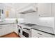 Modern kitchen features stainless steel appliances, subway tile backsplash and custom cabinetry at 1790 Mountain Farm Rd, Woodstock, GA 30188