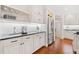 Kitchen featuring stainless steel appliances and white cabinets at 1790 Mountain Farm Rd, Woodstock, GA 30188