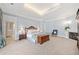 Comfortable main bedroom with sitting area and fireplace at 1790 Mountain Farm Rd, Woodstock, GA 30188
