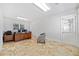 Bright office space featuring neutral tones, a large desk, and multiple windows at 1790 Mountain Farm Rd, Woodstock, GA 30188