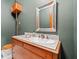 Charming powder room with a unique mirror, antique vanity, and classic fixtures, exuding vintage charm at 1790 Mountain Farm Rd, Woodstock, GA 30188