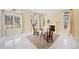 Bright sitting room featuring a fireplace and large windows with scenic views at 1790 Mountain Farm Rd, Woodstock, GA 30188