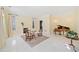 Spacious sitting room with fireplace, piano, and ample natural light at 1790 Mountain Farm Rd, Woodstock, GA 30188