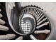 Overhead view of spiral staircase with dark wood stairs and white banister at 1790 Mountain Farm Rd, Woodstock, GA 30188