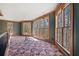 Bright upper room with large windows offering scenic views, complemented by custom woodwork and ample natural light at 1790 Mountain Farm Rd, Woodstock, GA 30188
