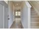 Bright entryway featuring hardwood floors and a staircase leading to the upper level at 2221 Croghan Dr, Hampton, GA 30228