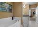 Bright bathroom with a soaking tub and granite countertop vanity at 2626 Peachtree Nw Rd # 704, Atlanta, GA 30305