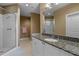Modern bathroom featuring a glass shower and granite countertop vanity at 2626 Peachtree Nw Rd # 704, Atlanta, GA 30305