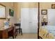 Bedroom featuring a classic four poster bed, desk, and neutral walls at 2626 Peachtree Nw Rd # 704, Atlanta, GA 30305