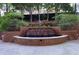 Beautiful outdoor space featuring a tiered fountain and landscaping at 2626 Peachtree Nw Rd # 704, Atlanta, GA 30305