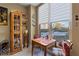 Sun-drenched dining area showcasing large windows and a charming table set for a cozy meal at 2626 Peachtree Nw Rd # 704, Atlanta, GA 30305