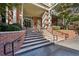 Grand entrance with brick stairs and manicured landscaping at 2626 Peachtree Nw Rd # 704, Atlanta, GA 30305