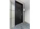 View of the unit's front door, number 704, in a secure building at 2626 Peachtree Nw Rd # 704, Atlanta, GA 30305