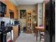 A view of the kitchen with wood cabinets, granite countertops, tile backsplash, and stainless steel appliances at 2626 Peachtree Nw Rd # 704, Atlanta, GA 30305