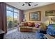 Cozy living room with large window providing natural light and stunning views of the outdoors at 2626 Peachtree Nw Rd # 704, Atlanta, GA 30305