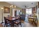 Charming dining and living room area featuring hardwood flooring, modern lighting, comfortable seating, and a view at 2626 Peachtree Nw Rd # 704, Atlanta, GA 30305