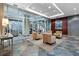 Elegant lobby area featuring tiled floors, comfortable seating, a neutral palette, and a decorative piece of art at 2626 Peachtree Nw Rd # 704, Atlanta, GA 30305