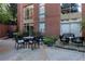 Outdoor patio area with seating for dining and relaxing at 2626 Peachtree Nw Rd # 704, Atlanta, GA 30305