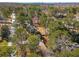 A cozy home in a secluded, wooded area, surrounded by lush greenery and mature trees at 2542 Maclaren Cir, Dunwoody, GA 30360
