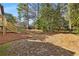 Spacious backyard with mature trees and landscaping at 2542 Maclaren Cir, Dunwoody, GA 30360