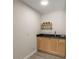 Convenient bar area features modern fixtures, sleek countertops, and stylish cabinetry at 2542 Maclaren Cir, Dunwoody, GA 30360