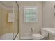 Bathroom with white fixtures, tub/shower and a large window for natural light at 2542 Maclaren Cir, Dunwoody, GA 30360