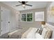 Cozy bedroom with bright natural light, decorative pillows, and complementing artwork at 2542 Maclaren Cir, Dunwoody, GA 30360