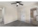 Inviting bedroom with a connecting bathroom, ceiling fan, and plush carpet at 2542 Maclaren Cir, Dunwoody, GA 30360